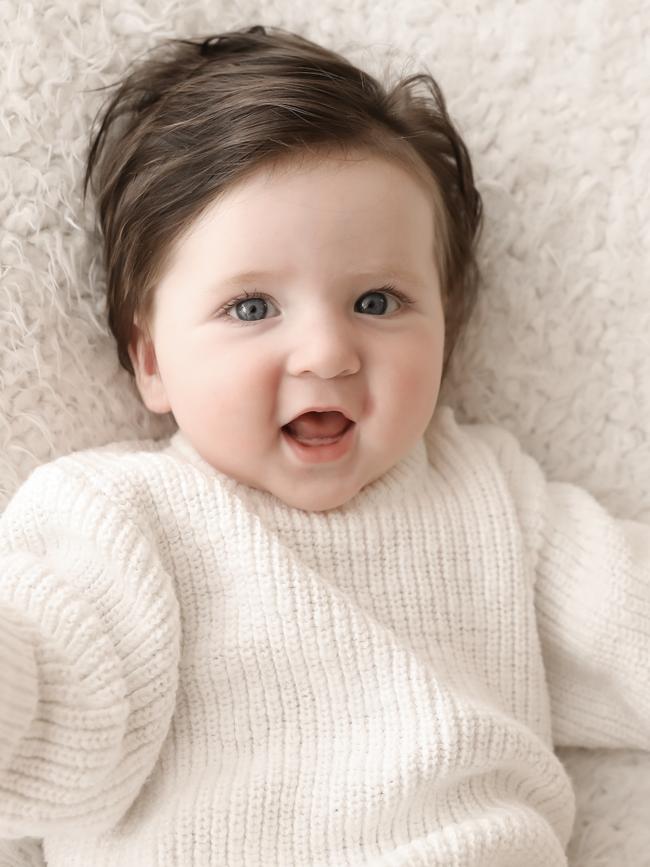 Maxwell, nine months old. Sorry, I cant hear you over the volume of my hair. Maxwell is nine months old and has had two haircuts so far. He loves to smile and clap hands on demand.