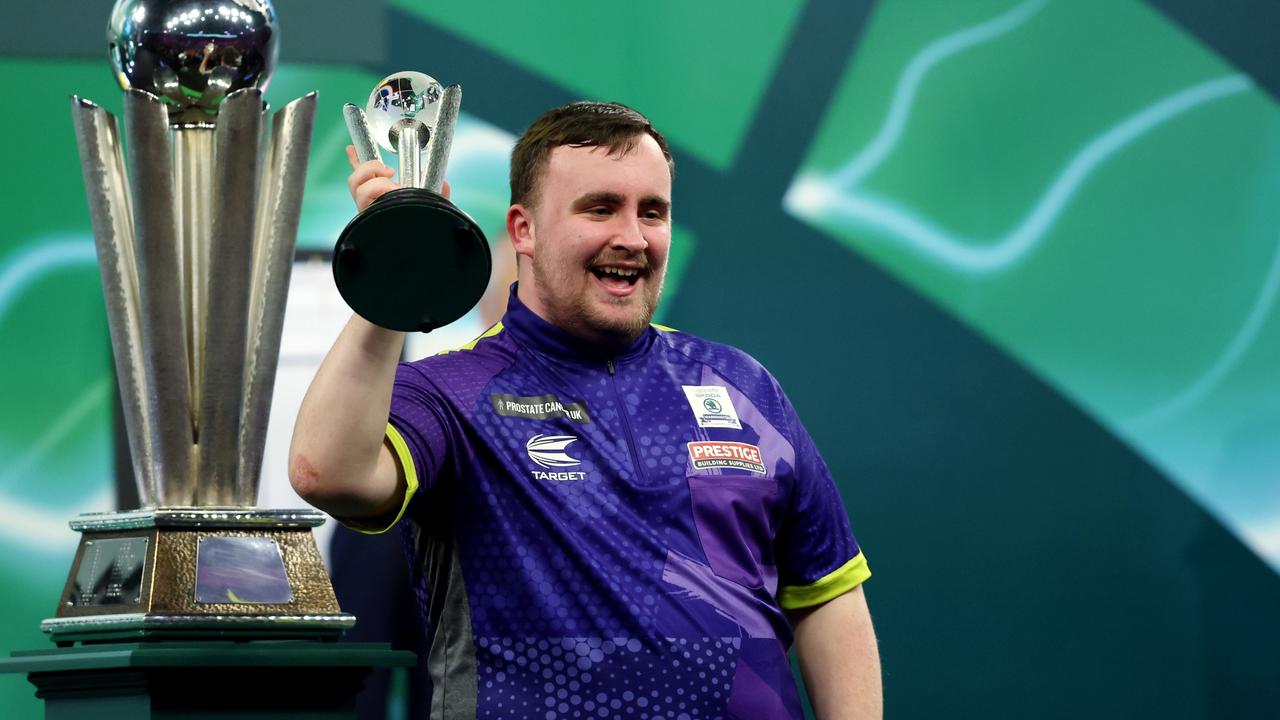 Runner-up Luke Littler of England celebrates with the runner-up troph. Photo by Tom Dulat/Getty Images.