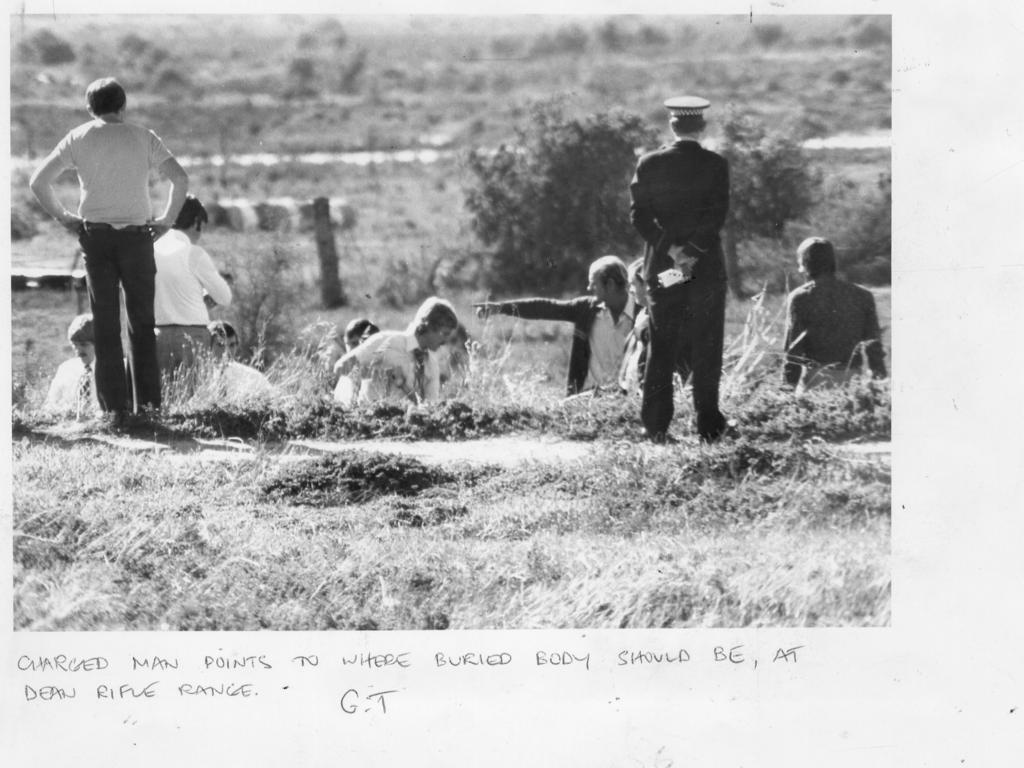 James William Miller points as he assists police in their search at Wingfield on May 24, 1979.