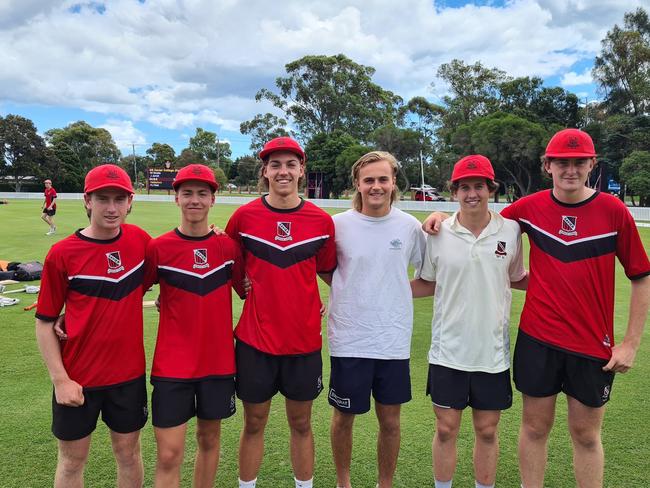 Xavier College 2021 captain Kye Walford presents baggy reds to Xavier Austin, James Jarrett, Charlie Barnett, Bohden Learmonth and Simon Greene.