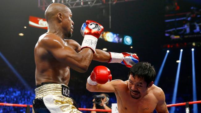 Manny Pacquiao throws a right at Floyd Mayweather Jr. in 2015. Picture: Al Bello/Getty Images