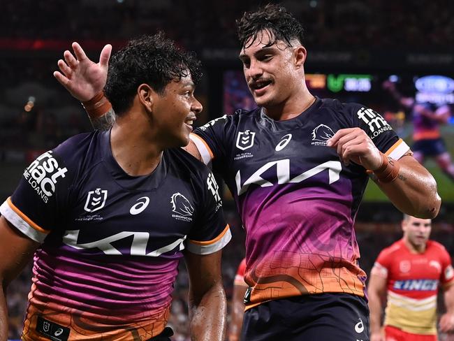 BRISBANE, AUSTRALIA - MARCH 24: Selwyn Cobbo (L) of the Broncos celebrates scoring a try with Kotoni Staggs during the round four NRL match between the Dolphins and Brisbane Broncos at Suncorp Stadium on March 24, 2023 in Brisbane, Australia. (Photo by Bradley Kanaris/Getty Images)