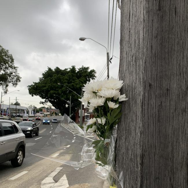 Flowers at Caltex service station where the crash occurred. Picture: Nicole Pierre