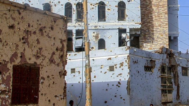 Bullet-riddled buildings in Omdurman, Sudan. Photo: Ebrahim Hamid/AFP