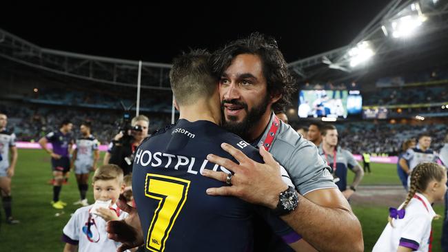 Cronk is congratulated by Thurston after last year’s grand final. Picture: Brett Costello