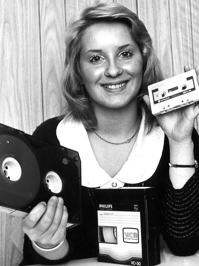 Lynda Pollard shows the difference between the standard cassette (right) and the two new colour TV cassettes in 1973.