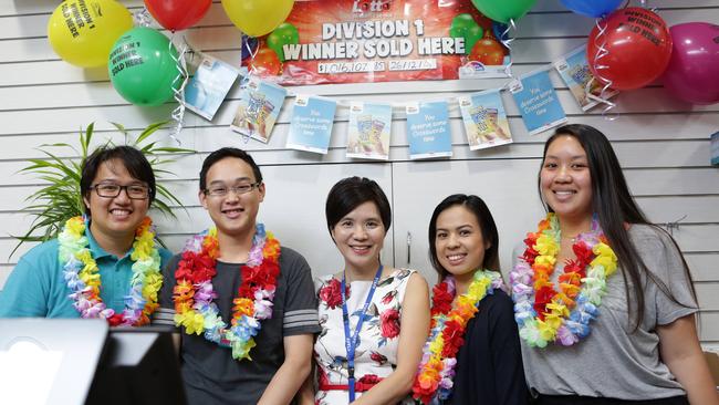 Andrew Nguyen, Danny Nguyen, Anne Huang, Anna Ton, Sarah Ngo from Mitchum News sold the winning division one ticket 11 days after the store relocated.