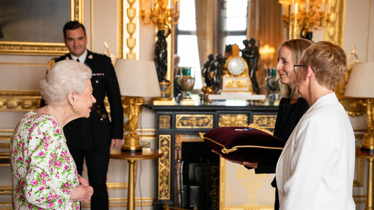 The Queen presents the George Cross to Judith Paget, Chief Executive NHS Wales and Dr Ami Jones. Picture: AFP