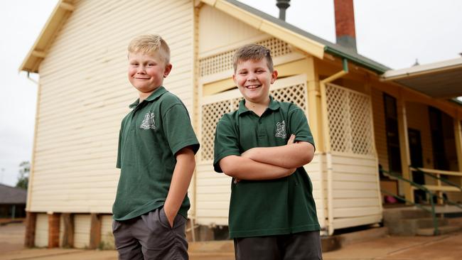 City-dwelling kids were surprised Cobar Public School students Mitch Allen, 10 and Rhys Cull, 10, weren’t paid to help on the farm and even more shocked hearing they shot feral pigs and cats on the farm. Picture: Jonathan Ng