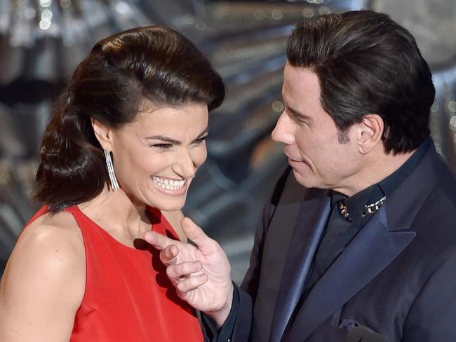 John Travolta stroking Idina Menzel’s face at the 2015 Academy Awards. (Photo by Kevin Winter/Getty Images)