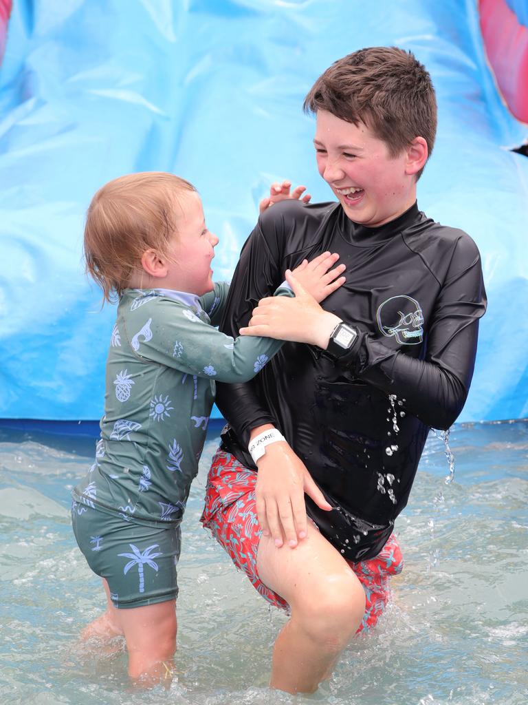 Charlie and Xavier on the water slide. Picture: Mark Wilson.