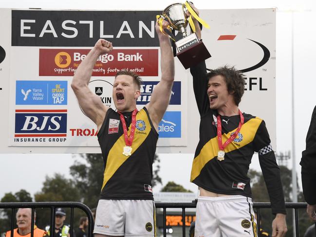 Neil Winterton and Jackson Glossop hoist the Division 2 premiership cup. Picture: Andy Brownbill