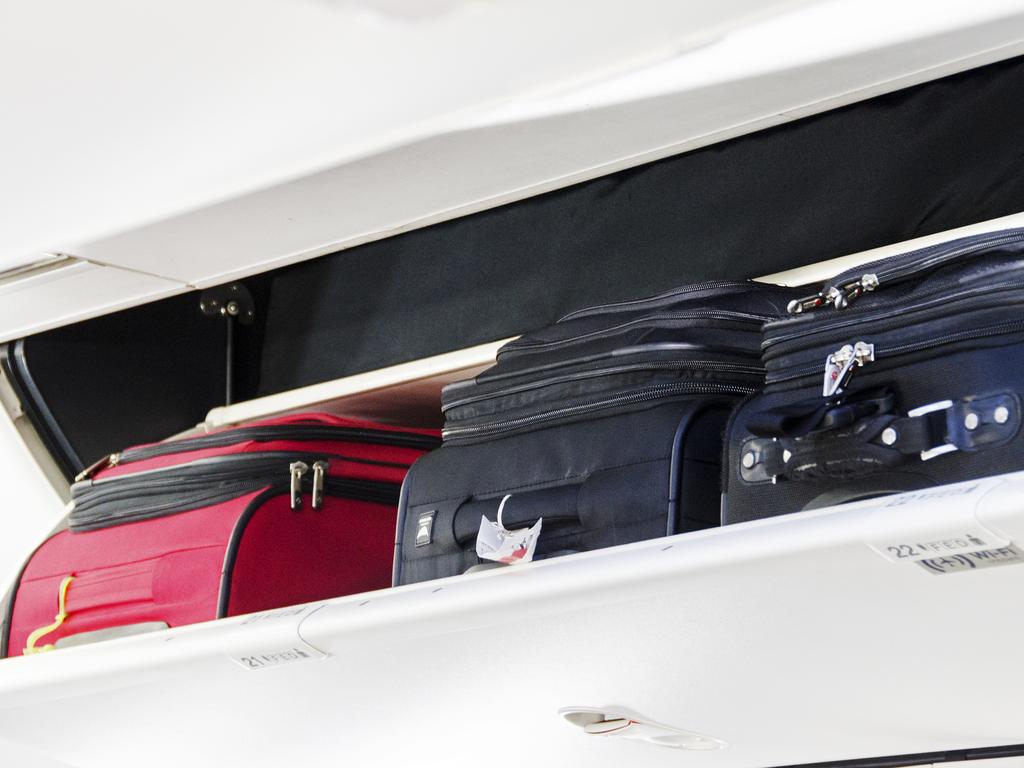 It’s no longer just enough to get your bag to fit in the overhead compartment — it still has to comply with the airline’s rules. Picture: iStock