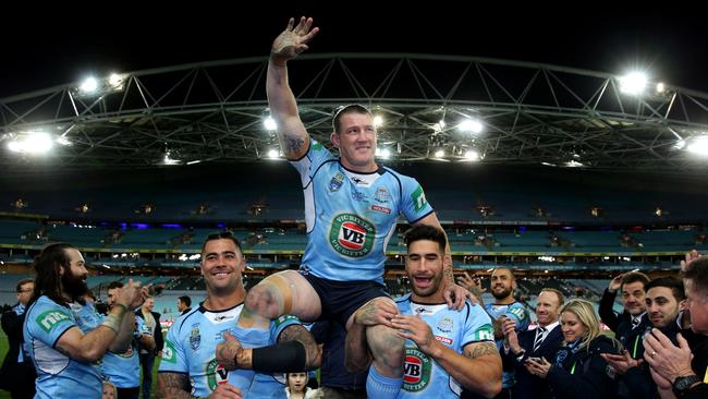 NSW's Paul Gallen chaired off the ground by Andrew Fifita and James Tamou during game 3 of the 2016 Origin series Photo: Gregg Porteous.