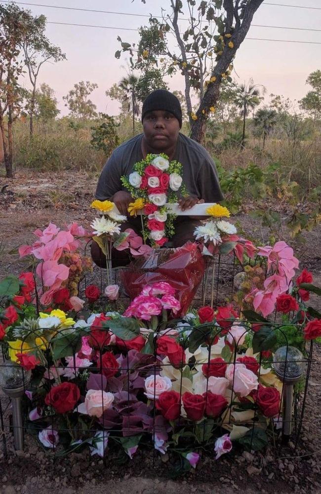 Janita Dixon, the daughter of alleged hit and run victim Kumanjayi Napurrurla Dixon, at her mother's roadside memorial.