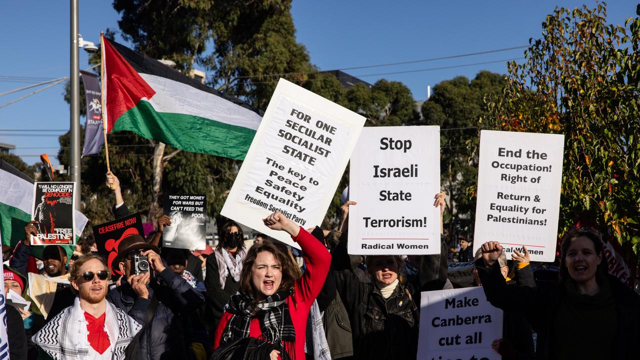 Signs held by the protesters – one displaying “Stop Israeli State Terrorism”. Picture: NCA NewsWire / Diego Fedele