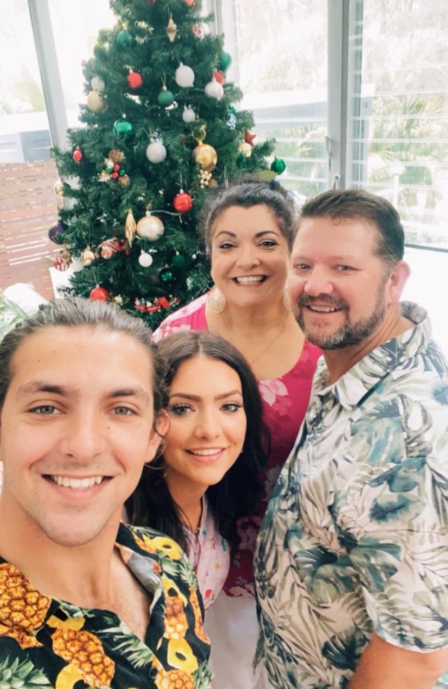 Carmen James with her husband and two children.