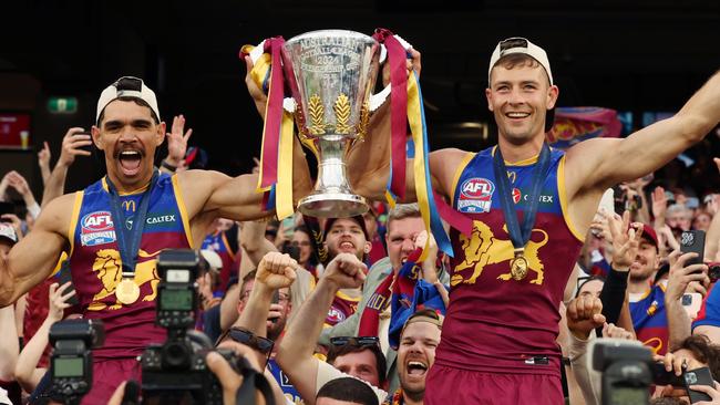 Brisbane Lions players celebrate winning the AFL Grand Final after defeating the Sydney Swans at the MCG. Picture Lachie Millard