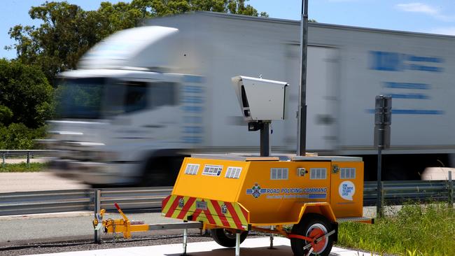 A mobile speed camera in the southbound lanes of the M1 near Dreamworld.