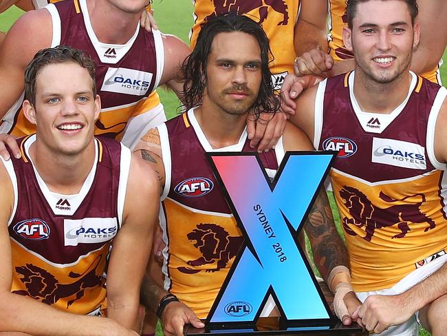 SYDNEY, AUSTRALIA - FEBRUARY 17:  The Lions team pose with the trophy after victory in the AFLX grand final match between the Sydney Swans and the Brisbane Lions at Allianz Stadium on February 17, 2018 in Sydney, Australia.  (Photo by Mark Kolbe/Getty Images)