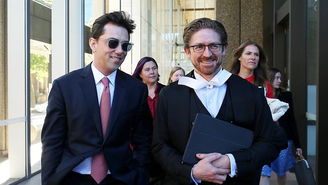 Journalist Joe Aston leaving Federal Court in 2020 with his lawyer during his defamation trial against Blue Sky’s Dr Elaine Stead.