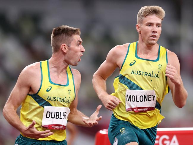 Cedric Dubler urges Ashley Moloney on in the final event of the decathlon. Picture: Getty Images