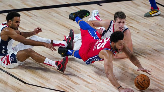 Desperate Ben Simmons goes for a loose ball (Photo by Ashley Landis-Pool/Getty Images)