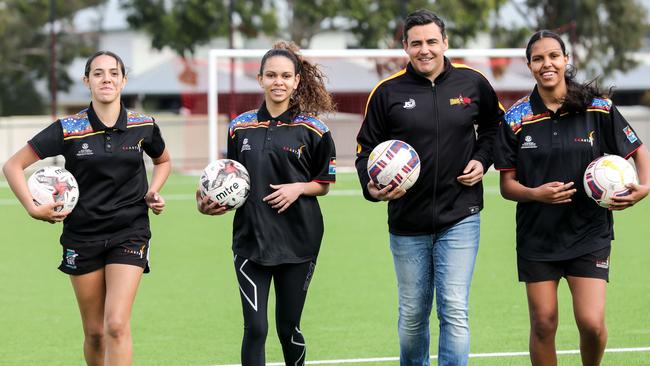 Australia's first indigenous Socceroos goalscorer Travis Dodd launches a new program for indigenous soccer players, from left, Tesha Wanganeen, Annelse Kowcun and Ambah Kawcun at T.K. Shutter Reserve, Klemzig. Picture: AAP Image/Russell Millard