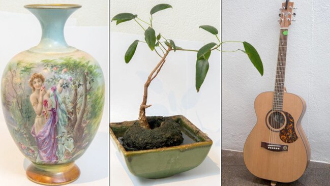 Treasured items: Painted vase, bonsai plant and a Maton guitar.