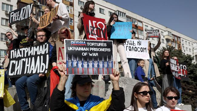 Relatives and friends of Ukrainian prisoners of war from the Azov Brigade and sub-units hold placards during a rally in the center of Kyiv, calling for their exchange with Russian prisoners, amid Russian invasion in Ukraine. Picture: AFP