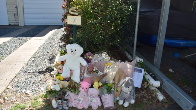 Tributes outside the Bean St home.