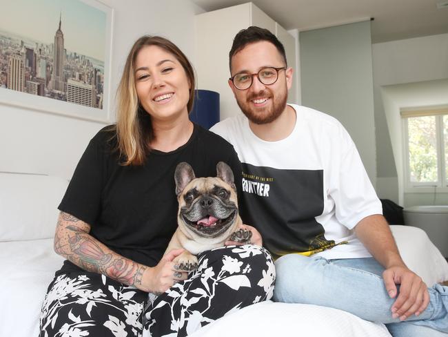 Sarah Prgomelja, 30 and fiancee Jamie Hayman, 29, who have a French bulldog named Edgar who's 5. They leave the aircon on when they go out to keep their Edgar cool and even sleep with it on all the time when its hot, even when under the doona at night. Picture: Richard Dobson 