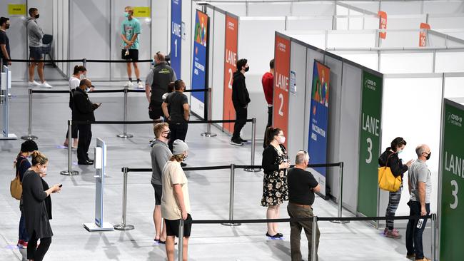 People queue up to receive the Pfizer Covid-19 vaccine at the newly opened community vaccination hub at the Brisbane Entertainment Centre in Boondall. Picture: NCA NewsWire / Dan Peled