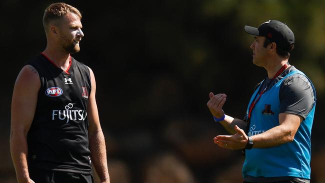 Essendon coach Brad Scott (right) says he expects forward Jake Stringer to sign a new deal to remain at the Bombers. Picture: Michael Willson / Getty Images