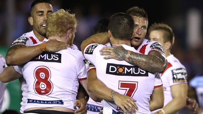 Dragons players celebrate a try during their Round 2 win over Cronulla.