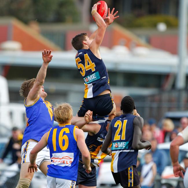 Brandon White soars over the pack in the 2014 grand final. Picture: David Trend