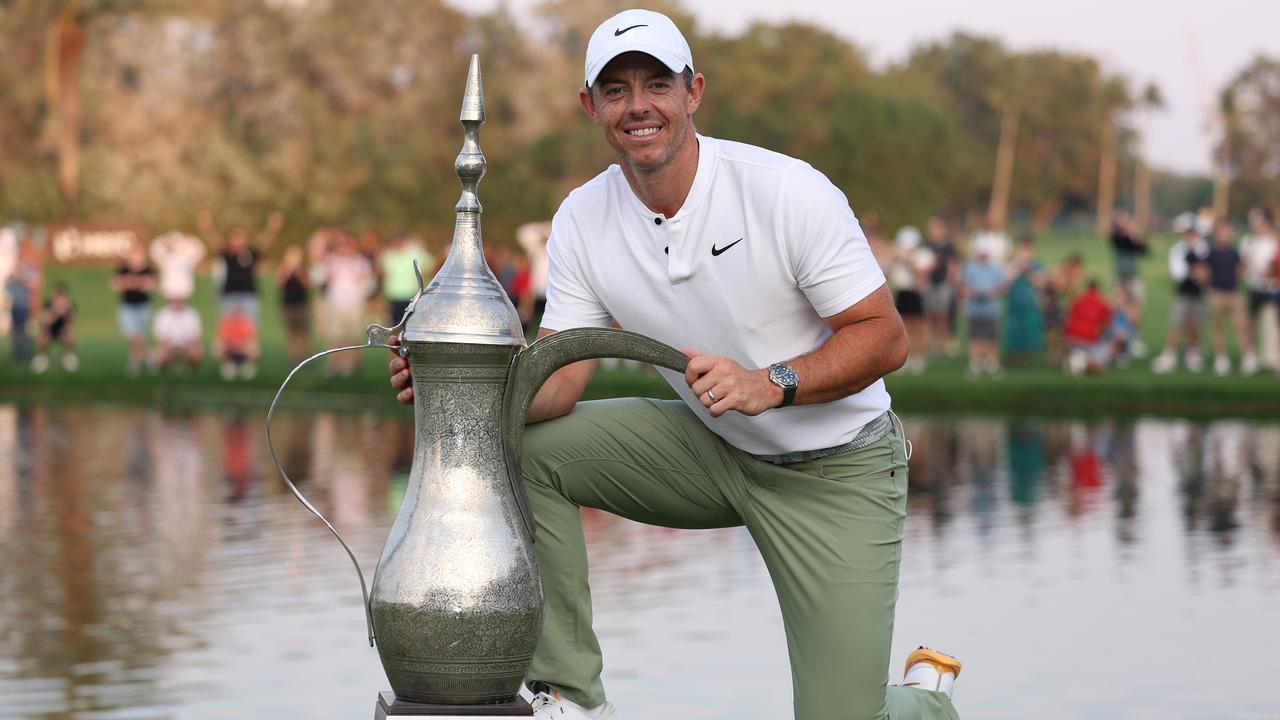 DUBAI, UNITED ARAB EMIRATES - JANUARY 21: Rory McIlroy of Northern Ireland poses with the trophy, signalling his fourth victory after the final round of the Hero Dubai Desert Classic at Emirates Golf Club on January 21, 2024 in Dubai, United Arab Emirates. (Photo by Richard Heathcote/Getty Images)