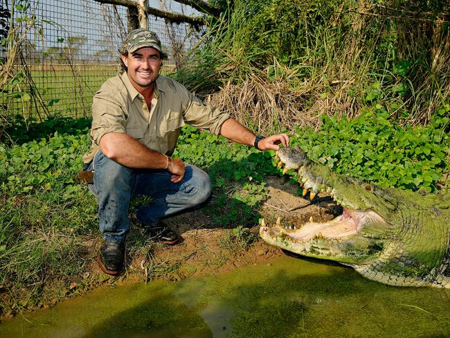 2018: Outback wrangler Matt Wright with his pet crocodile Tripod who is estimated to be around 80 years old.