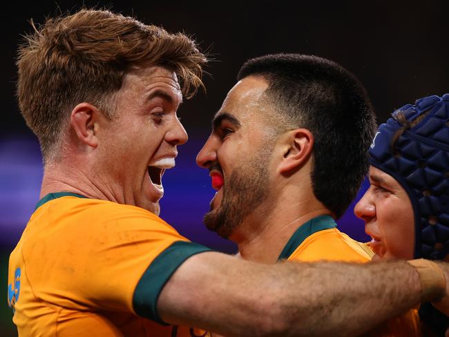 SYDNEY, AUSTRALIA - JULY 06: Tom Wright of the Wallabies celebrates with Andrew Kellaway after scoring a try during the men's International Test match between Australia Wallabies and Wales at Allianz Stadium on July 06, 2024 in Sydney, Australia. (Photo by Jason McCawley/Getty Images)