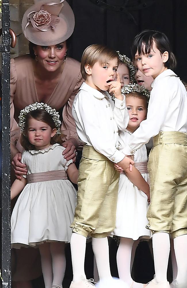 Prince George was also a pageboy at Pippa Middleton’s wedding, while Princess Charlotte can be seen with her mum. Picture: AFP PHOTO / POOL AND AFP PHOTO / Justin TALLIS