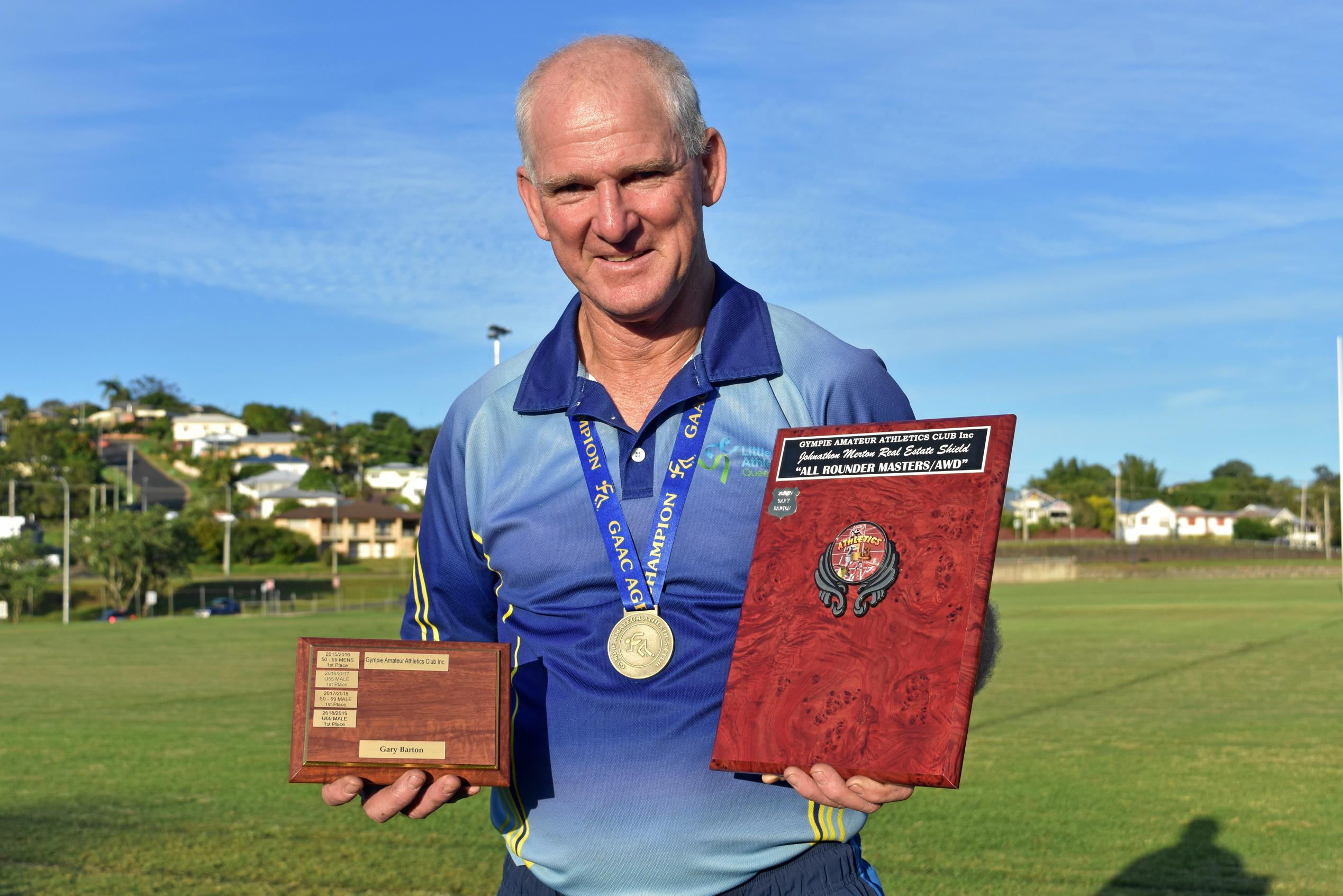 Athletics - Under 60 age champion and Johnathan Merton Real Estate All-rounder shield for masters/AWD Gary Barton. Picture: Bec Singh