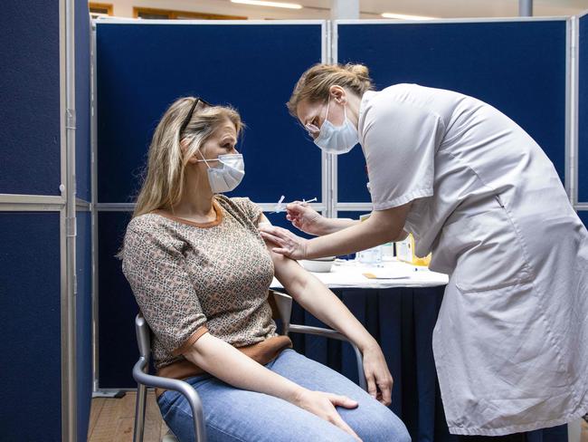 A healthcare worker is vaccinated with the single-dose Johnson &amp; Johnson Janssen vaccine in Amsterdam. Picture: AFP / Netherlands OUT