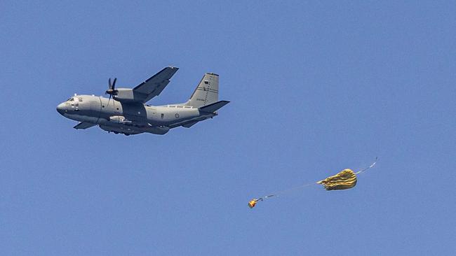 A C-27J Spartan drops essential supplies in the Timor Sea below. Picture: Department of Defence.