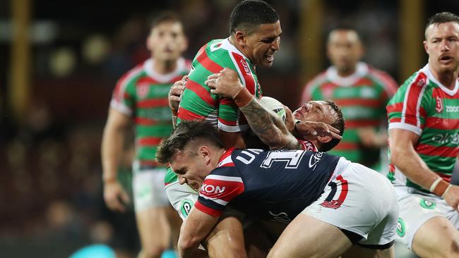 Souths star Cody Walker is tackled by Rabbitoh-turned-Rooster Angus Crichton. Picture: Brett Costello