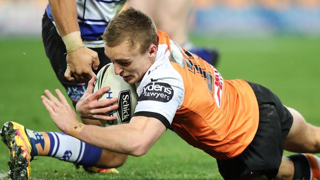 Jacob Liddle scores a try a try for the Tigers. Picture: Brett Costello