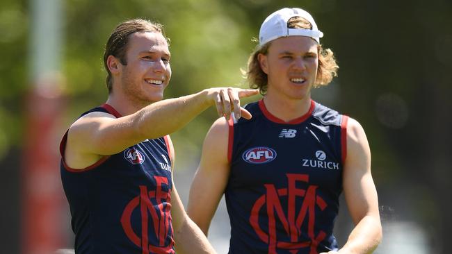 Melbourne recruit Ed Langdon, left, chats to new teammate Jayden Hunt at training. Picture: Quinn Rooney/Getty