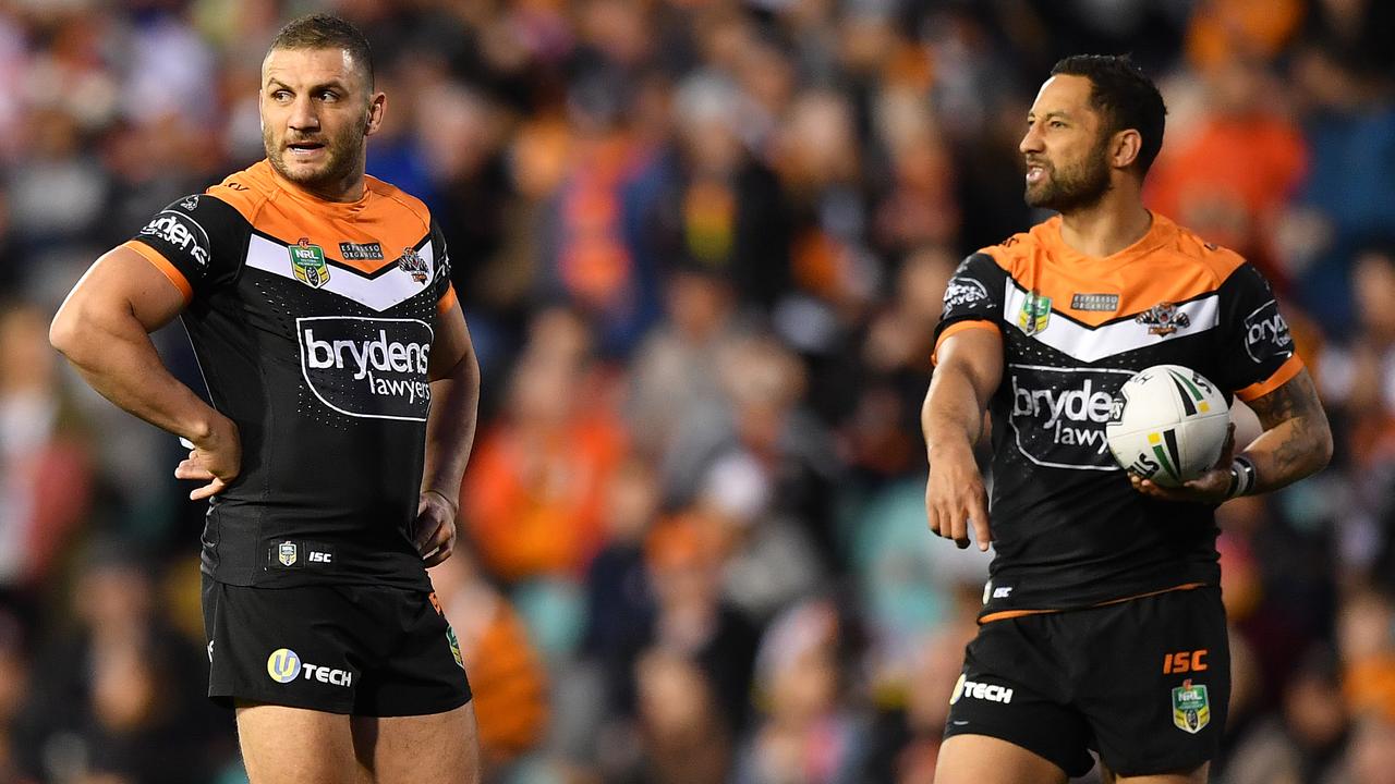 One more year: Robbie Farah (left) and Benji Marshall of the Tigers have told the club they want to play on in 2020. (AAP Image/Joel Carrett)