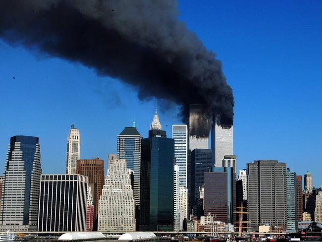 The twin towers of the World Trade Center billow smoke before they collapse. Picture: Henny Ray Abrams