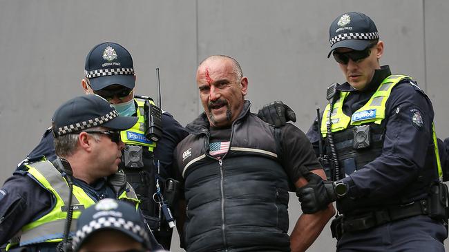 A protester is arrested by police. Picture: Ian Currie