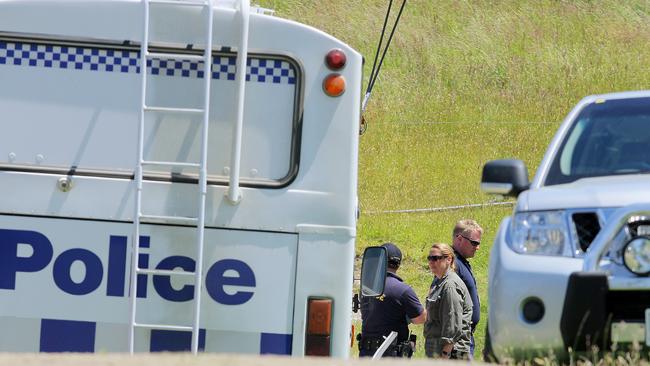 Police at the murder scene in 2011.